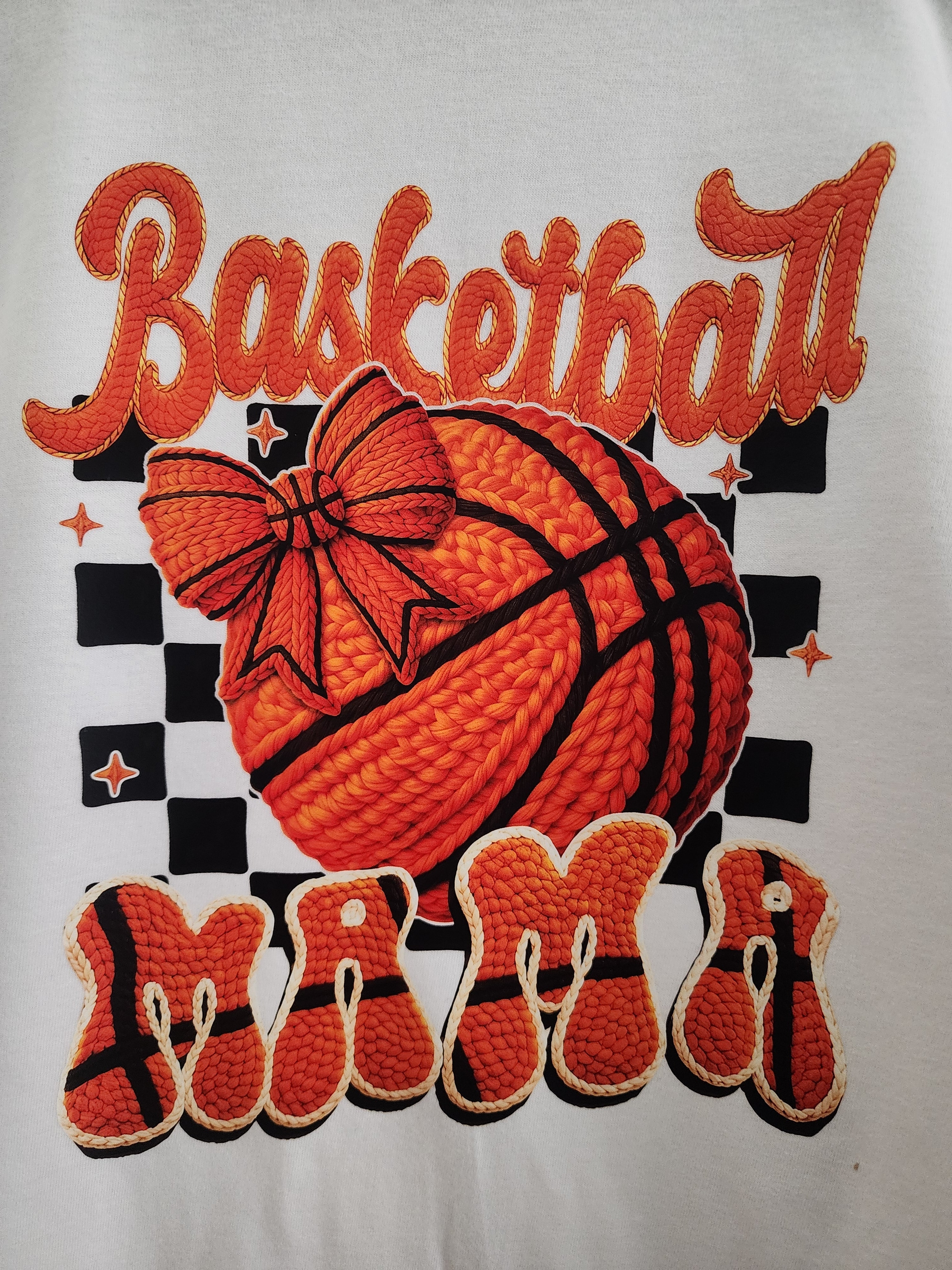 Basketball Mama with Bow DTF print close-up - 3D crochet basketball with orange bow on checkered background