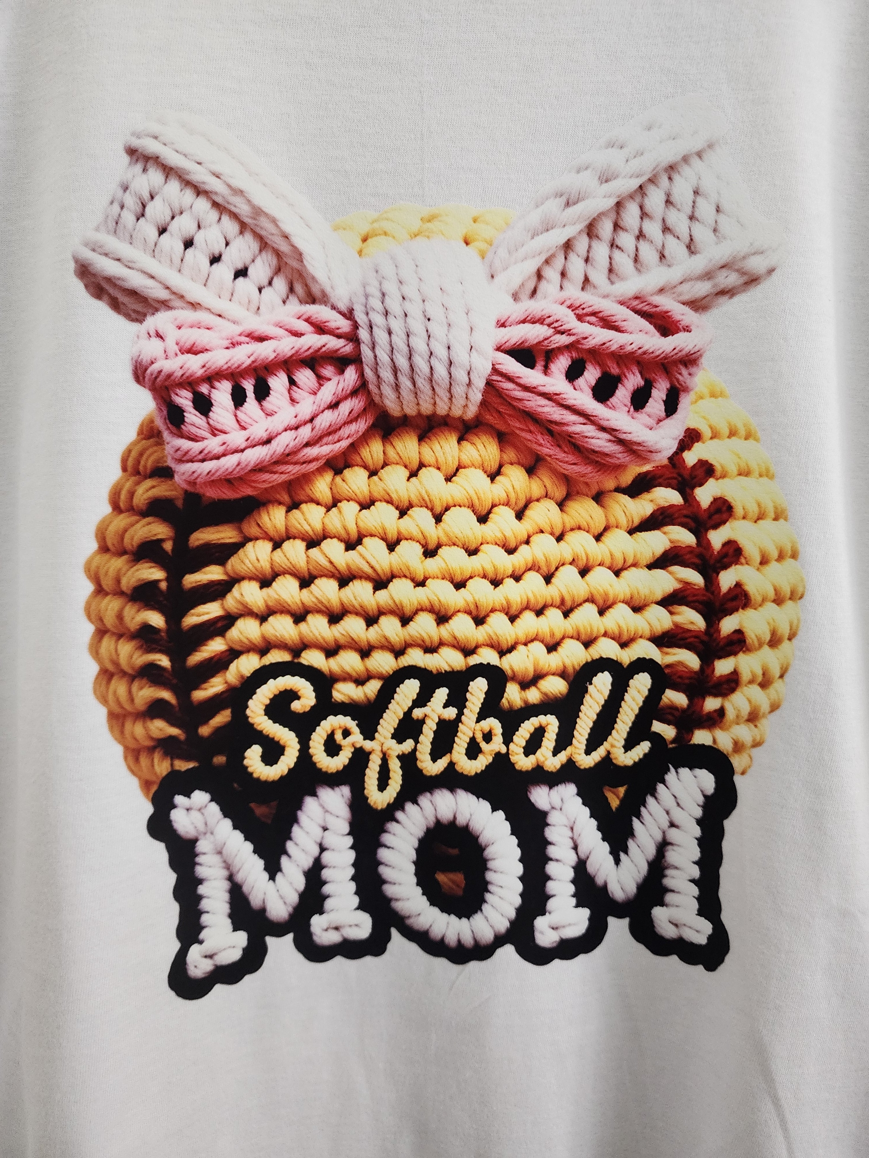Softball Mom crochet-style DTF print close-up - 3D knit softball with pink bow