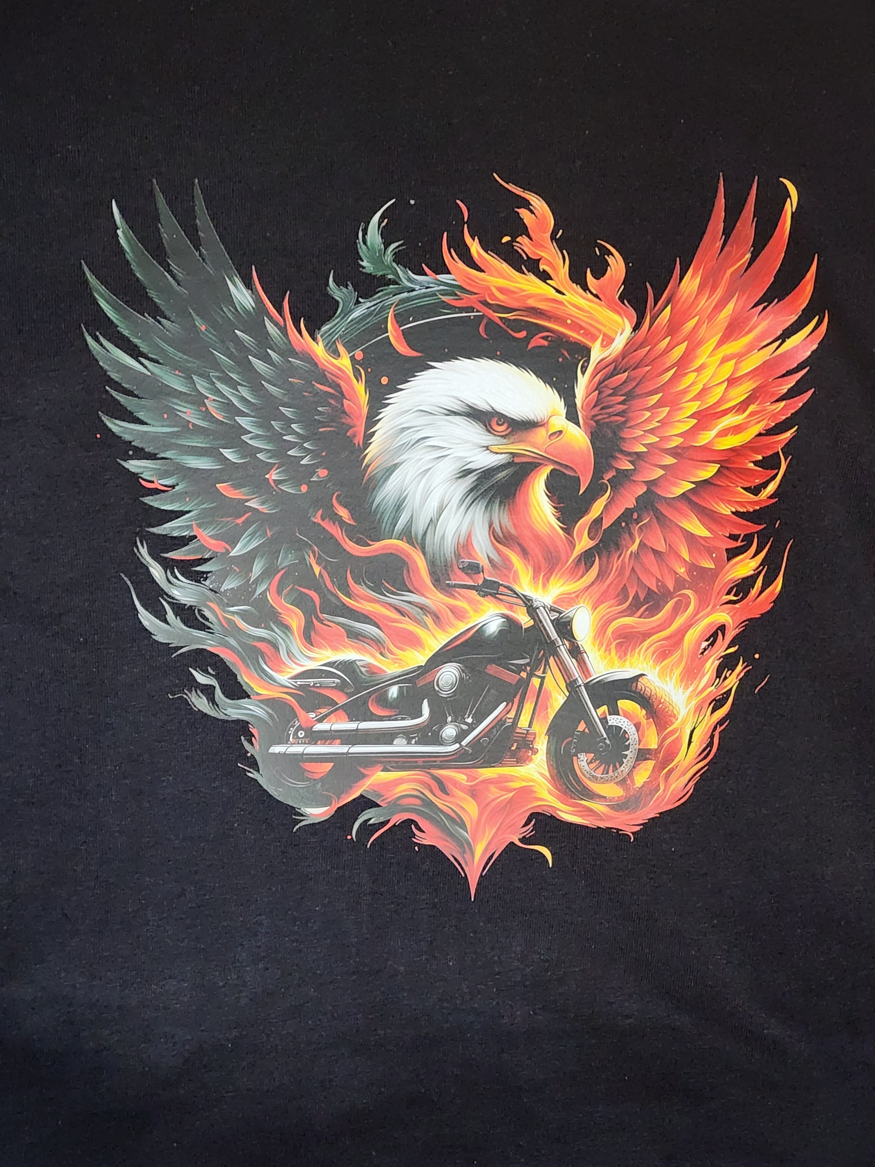 Close-up of flaming eagle and chopper print in fire colors